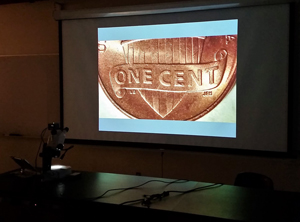 Projection of a penny from one of the microscopes. 