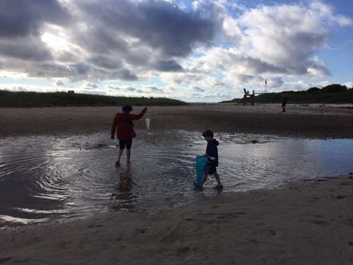 Prakash and his nephew exploring Wood Neck Beach, Falmouth.