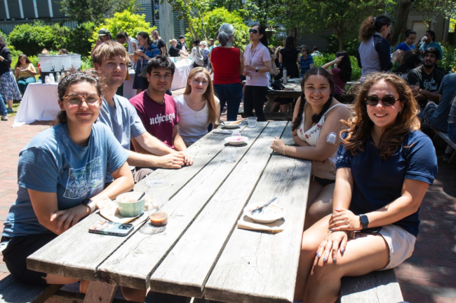Alumni gathered around a table