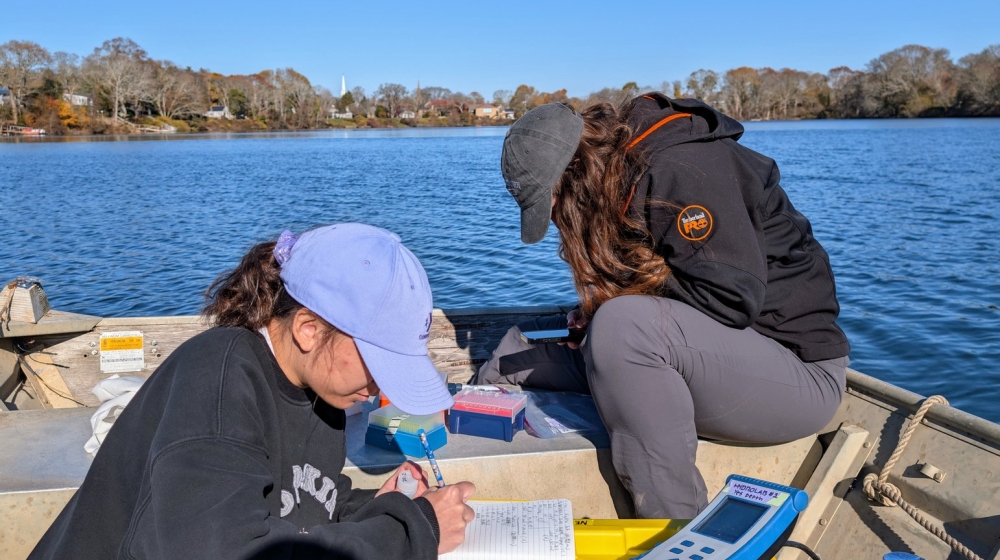 SES Student Hoang Luu performs field work Siders Pond in Falmouth, MA. Credit: Joe Vallino