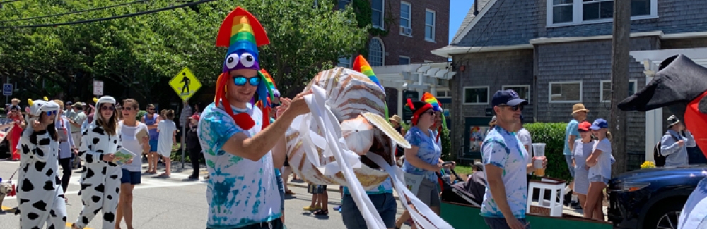 Grass Fellows march in the 2022 4th of July Parade in Woods Hole