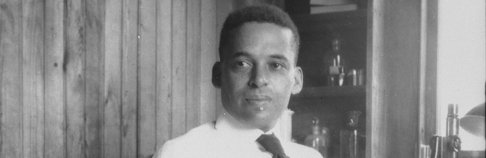 Ernest Everett Just with microscope. Credit MBL Archives