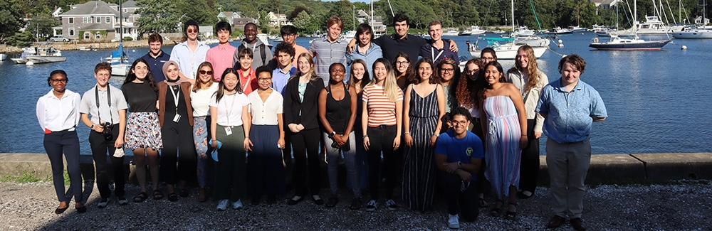 Undergraduates standing in front of Eel Pond