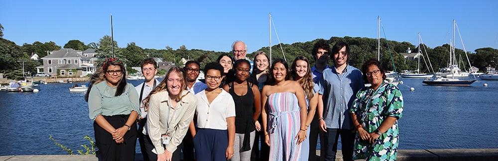 Undergraduates standing in front of Eel Pond