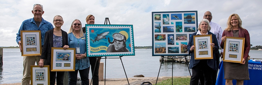 Woods Hole scientific leadership join USPS officials to commemorate ocean-themed stamps.