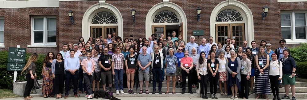 Attendees of the Neurobiology 50th Anniversary Symposium pose on the steps of Lillie Laboratory.