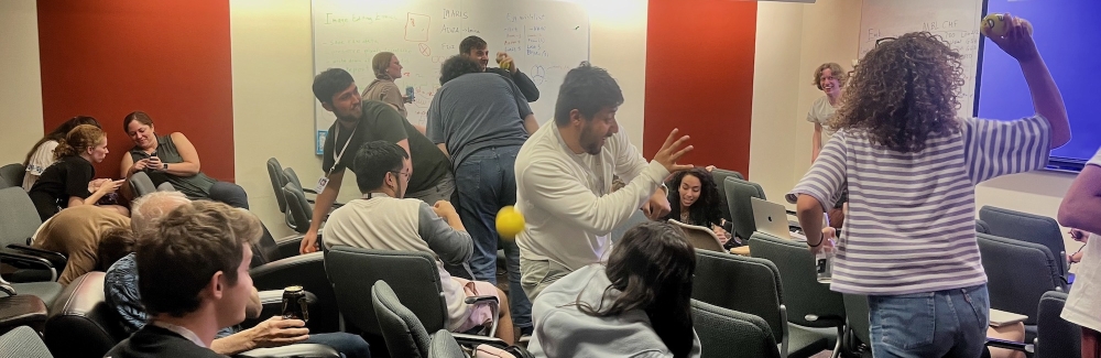 2024 Embryology students throw balls at each other after completing their final Show 'N Tell event.