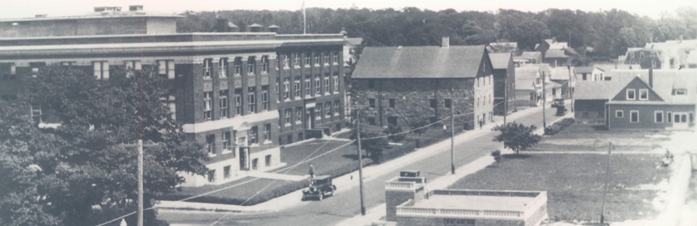 The Lillie Building and its Crane wing (on the left), the stone building on the right next to the brick Crane wing is the Candle House.