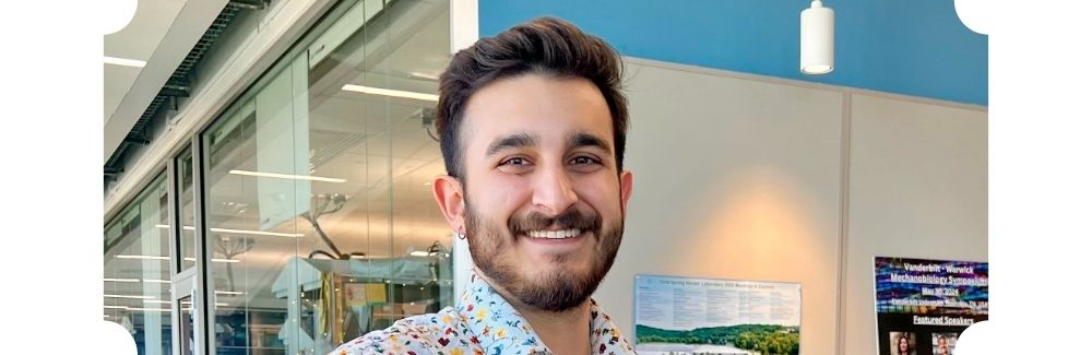 A scientist smiling at the camera
