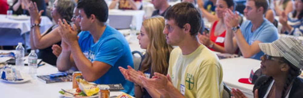 SUCCESS participants applaud at the end of a panel discussion.