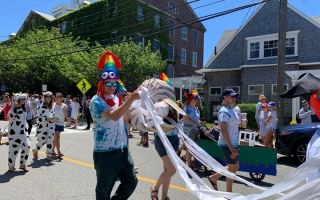 Grass Fellows march in the 2022 4th of July Parade in Woods Hole