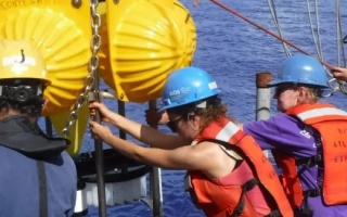 Marine Biological Laboratory Fellow Maureen Conte (center right) and crew of the R/V Atlantic Explorer recover a deep ocean sediment trap. (Courtesy J.C. Weber)