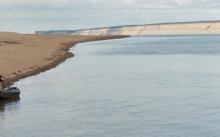 The Lena River in Siberia with boats used by fisherman.