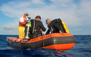 William Browne in scuba gear on a boat