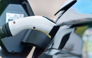 Charger plugged into electric vehicle.