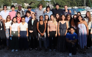 Undergraduates standing in front of Eel Pond