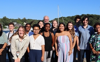 Undergraduates standing in front of Eel Pond