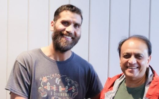 Two scientists, smiling 