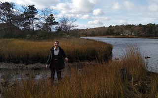 Semester in Environmental Science (SES) Student Claire McGuire prepares to take a sediment core sample in Waquoit Bay, Mass