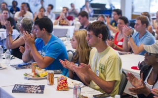 SUCCESS participants applaud at the end of a panel discussion. 