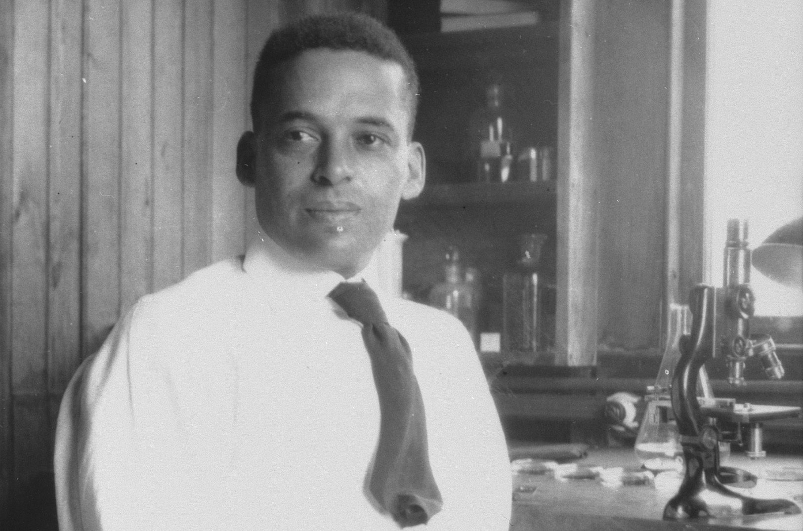 Ernest Everett Just with microscope. Credit MBL Archives