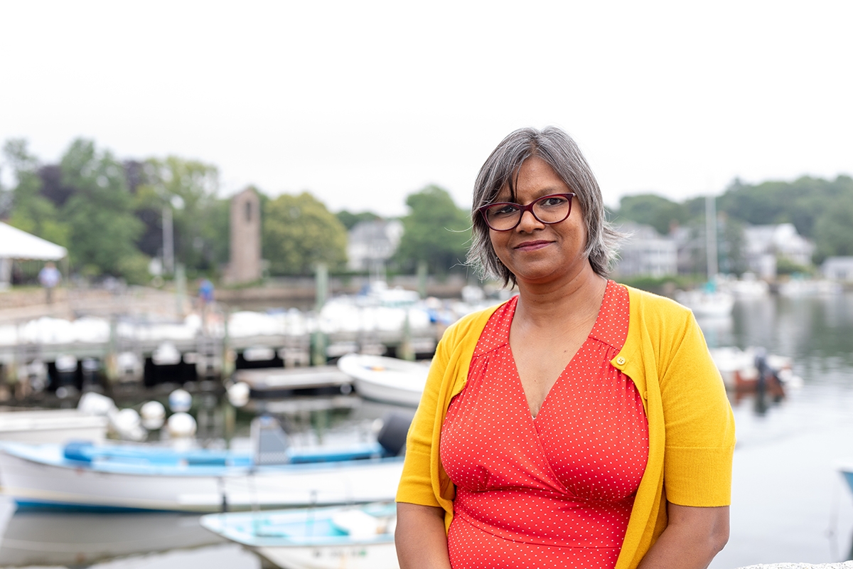 Indu Sharma, 2021 E.E. Just Fellow in front of Eel Pond. Credit: Dee Sullivan