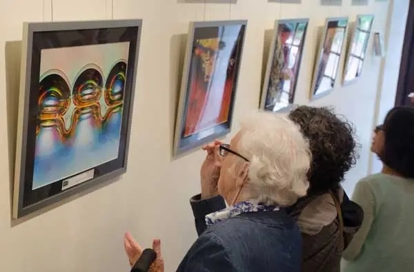 Guests view the Nikon Small World Exhibit in MBL's Lillie Lobby. Credit: Emily Zollo