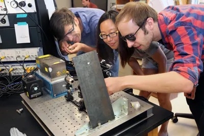 Former Grass Fellows in their MBL lab. Credit: Beth Armstrong