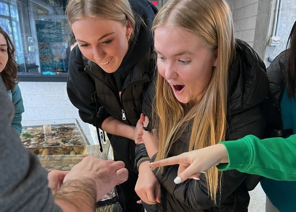 Two girls form the MBL High School Science Discovery Program on a tour of the MBL's Marine Resources Center. Credit: Jean Enright