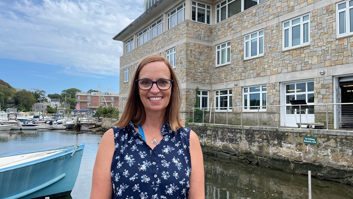 Lisa Abbo stands in front of my MBL Marine Resources Center.