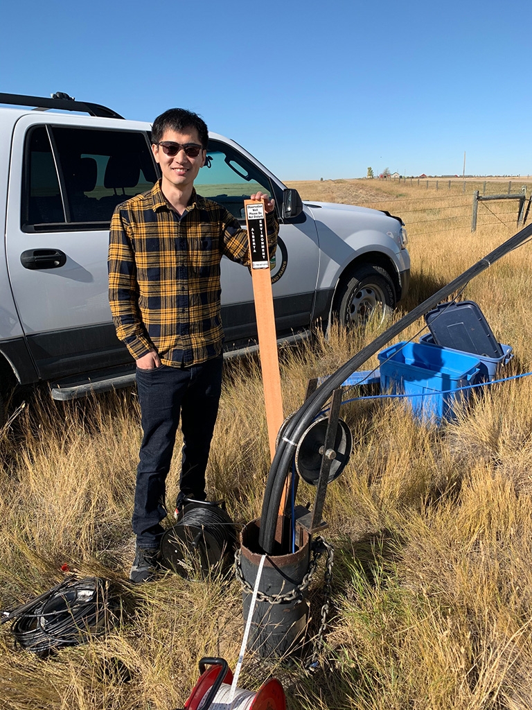 Muhe Diao on a sampling trip in Alberta