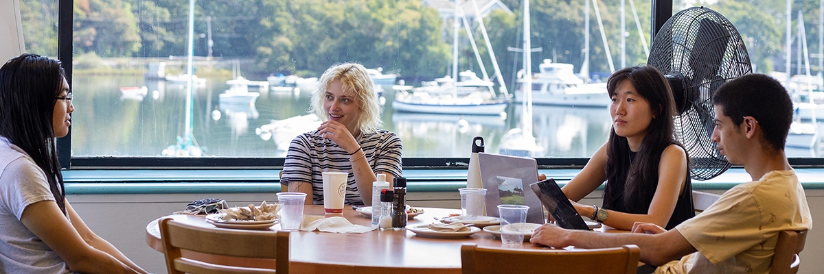 Students eating at Swope overlooking Eel Pond.