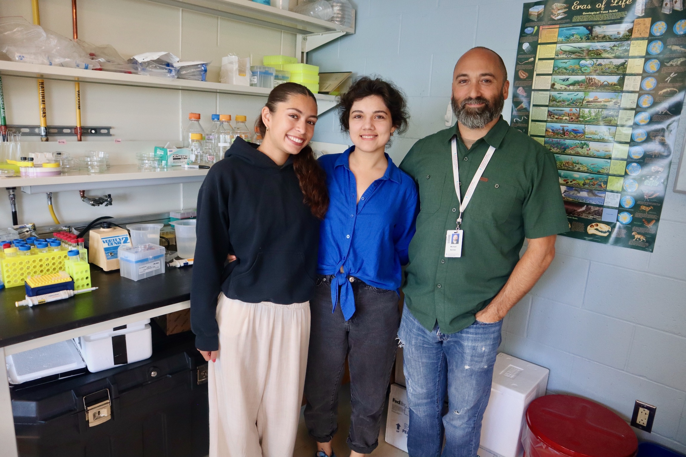 2024 Whitman Fellow Michael Barresi and undergraduates Tania Novosolova and Delia Parco stand in the lab