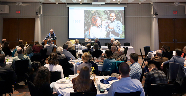 SES Symposium with speaker and audience shown