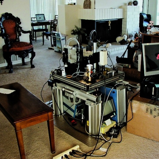 The original PALM microscope in Harald Hess's living room, where Betzig and Hess built it.