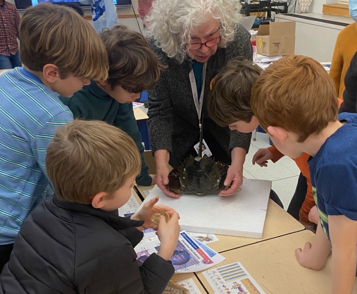 Judy Venuti with students in the after school program. Credit: Sarah Dundilis