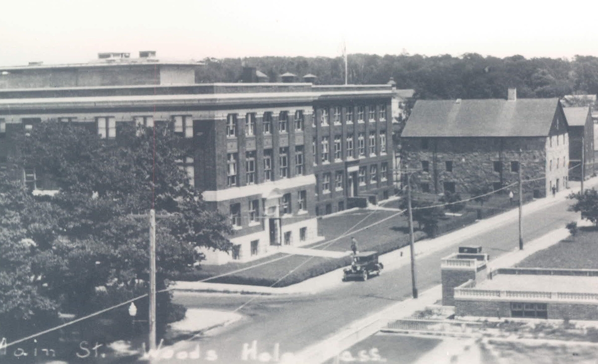 This circa 1934 photo shows the Lillie Building and its Crane wing on the left. The stone building on the right is Candle House.