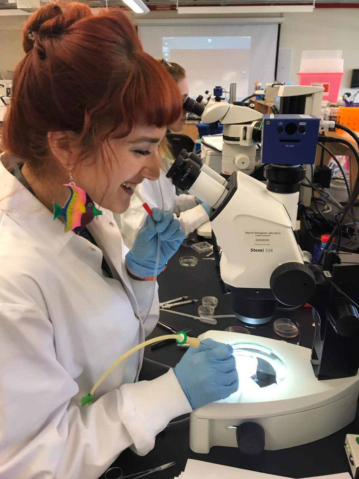 Kaitlyn Webster looking under microscope 