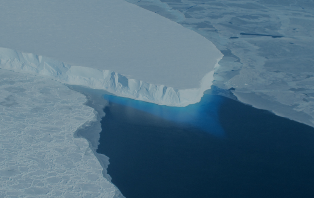 Large glacier surrounded by water.