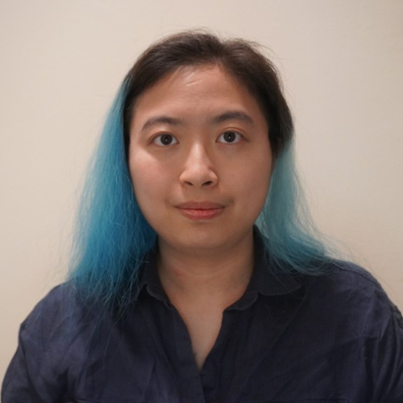 Female presenting person with blue dyed dark hair.