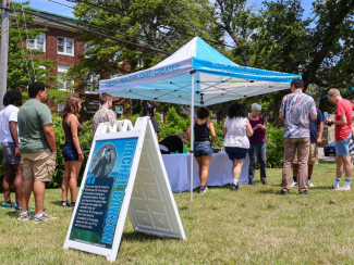 People line up for an ice cream social