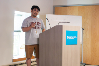 A scientist behind a podium.