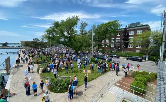 A crowd gathers in Waterfront Park to honor the Black Lives Matter Movement. Credit: Roger Hanlon