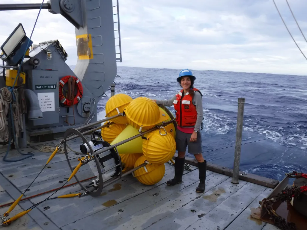 Rut Pedrosa Pàmies near a sediment trap during a redeployment of the Oceanic Flux Program mooring onboard the R/V Atlantic Explorer. Credit: JC Weber